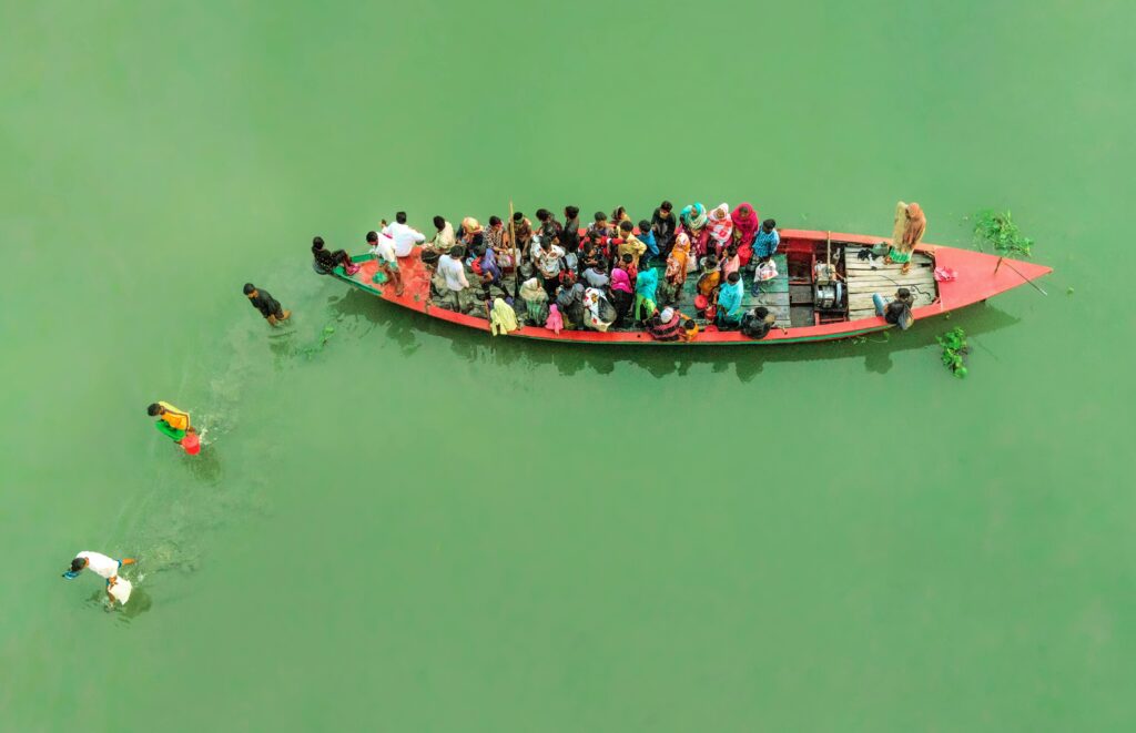 Crowded boat carrying people through the waterways of the Sundarbans, Bangladesh