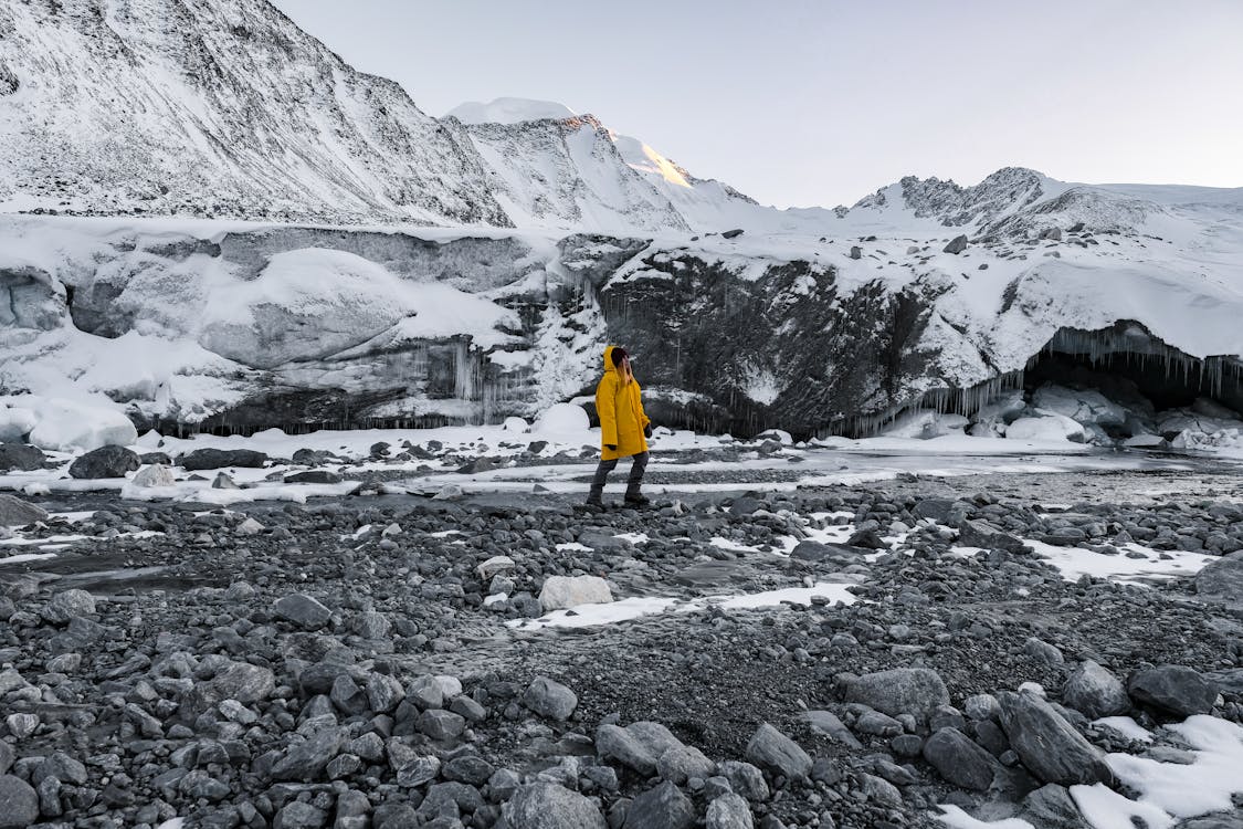 Backpacker with proper gear hiking through mountainous terrain in Mongolia
