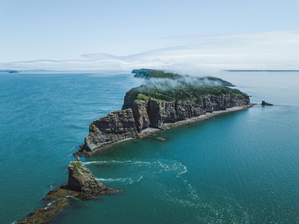 Dramatic cliffs surrounded by tidal waters at the Bay of Fundy, Canada, known for the world’s highest tides and stunning coastal views