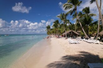 A luxurious all-inclusive resort in the Caribbean featuring turquoise waters, and pristine white sand beaches