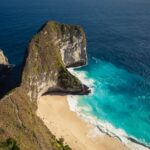 Aerial view of a beautiful Bali beach during dry season with clear turquoise water and white sand