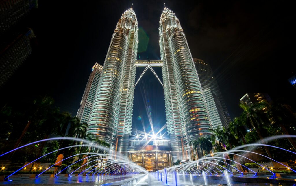 Petronas Twin Towers, one of the best places to visit in Malaysia, lit up at night in Kuala Lumpur