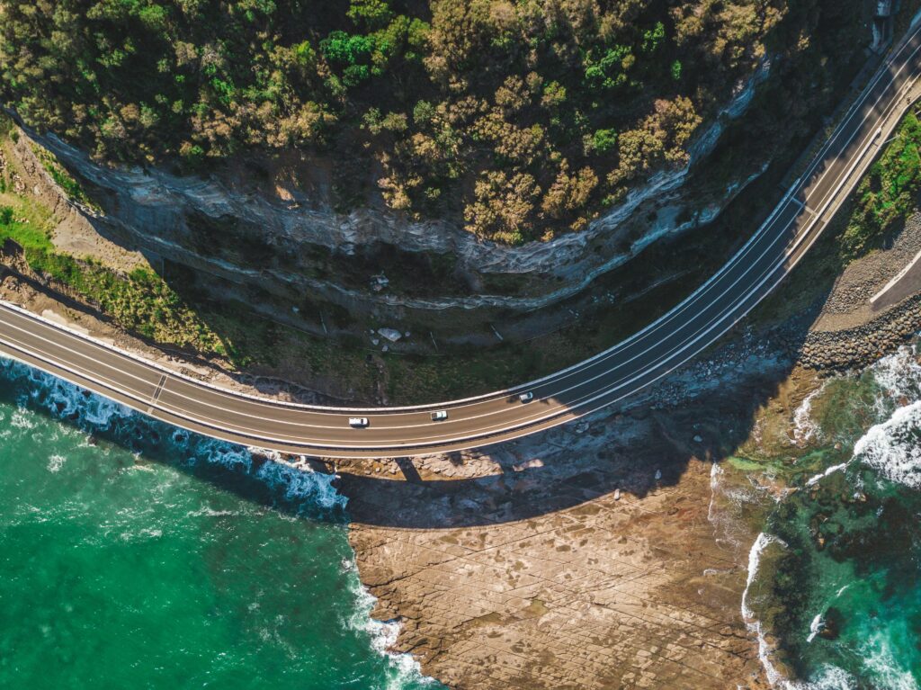 Vehicle traversing one of the best road trips in Australia along the Great Ocean Road