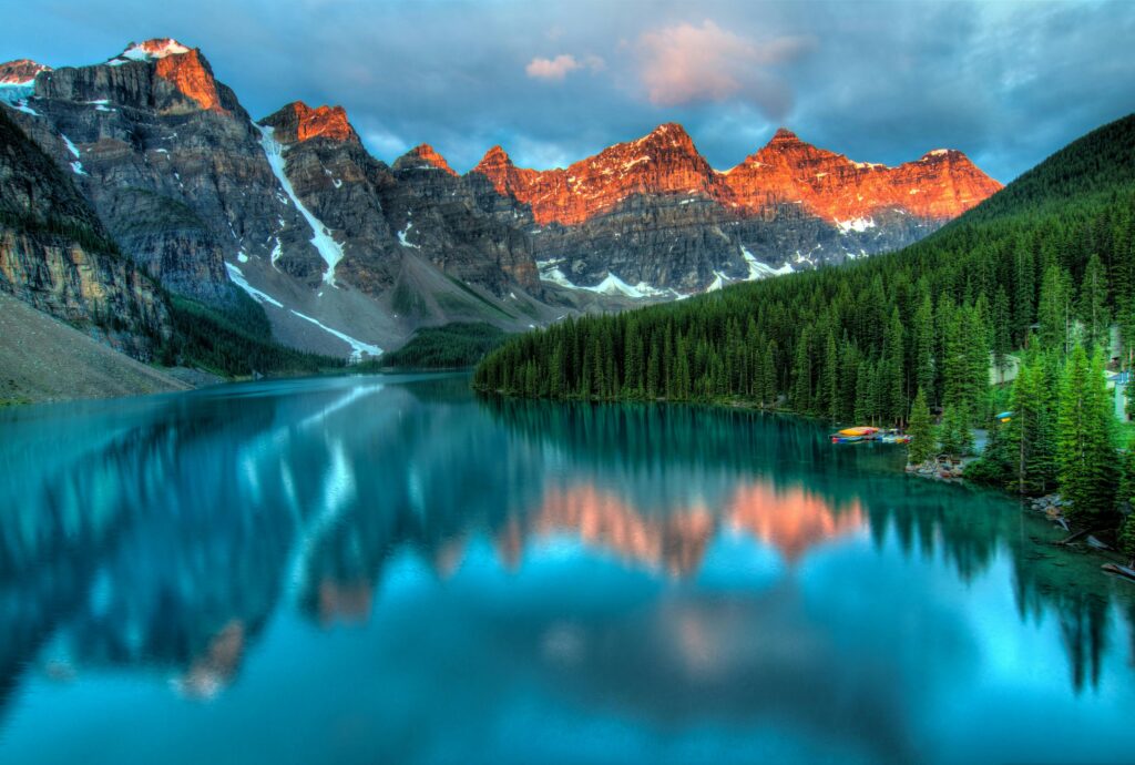 July travel destinations - Lake Louise in Banff National Park with mountain reflections