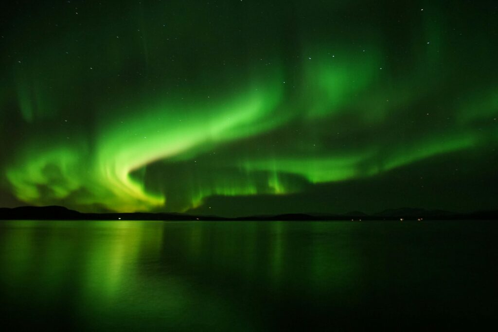 Spectacular Northern Lights display over Iceland, essential knowledge for how to chase the Northern Lights in Iceland