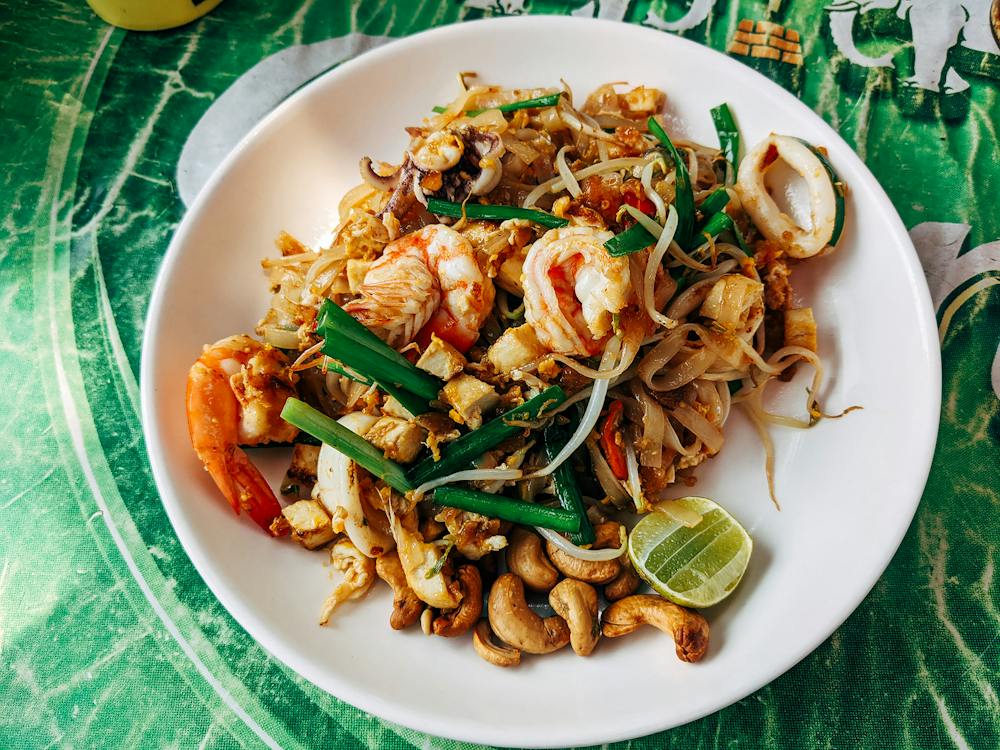 Fresh Pad Thai preparation at Bangkok street food market - traditional Thai dishes