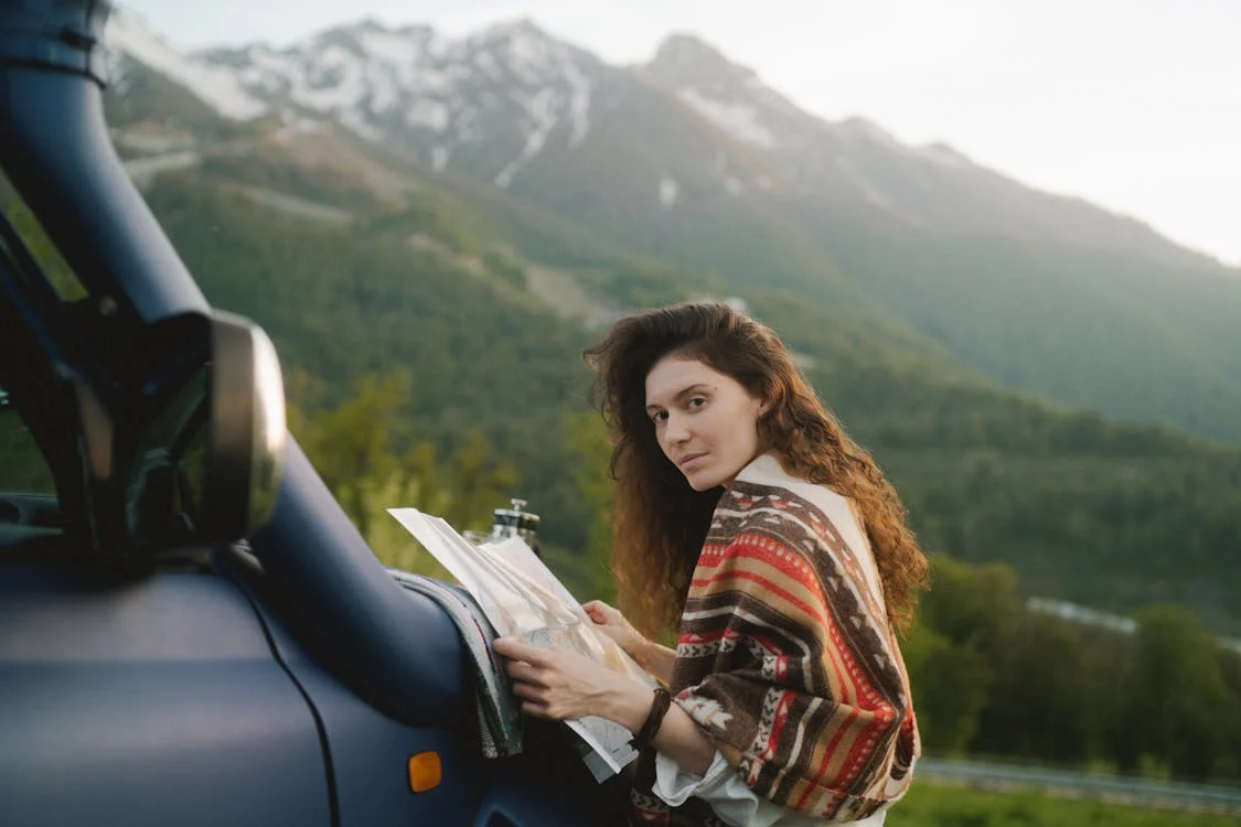 Planning a European road trip with maps and guidebooks