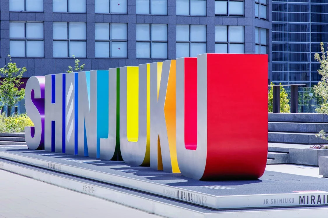 Shinjuku banner displayed in front of Miraina Tower, Tokyo, Japan – showcasing urban cityscape and local signage near Shinjuku Station