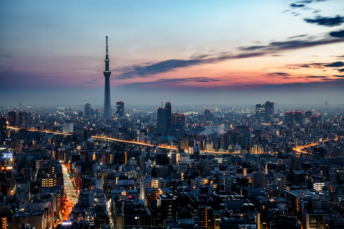 Best places to stay in Tokyo showing the contrast between modern skyscrapers and traditional temples