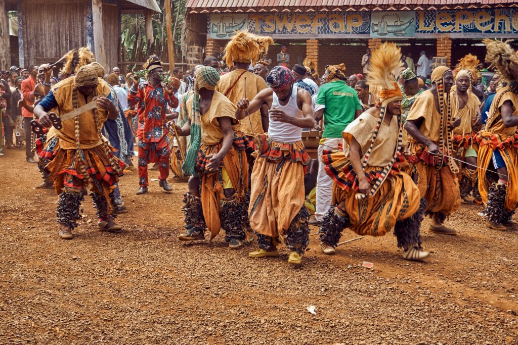 Solo traveler participating in traditional dance with local community members during first solo trip to Africa