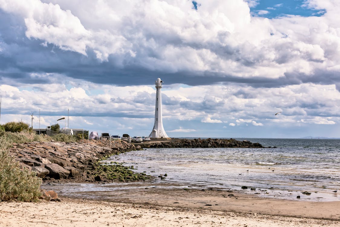 St. Kilda Beach with the iconic Gray Lighthouse standing on the shore, offering scenic views of the ocean and coastline