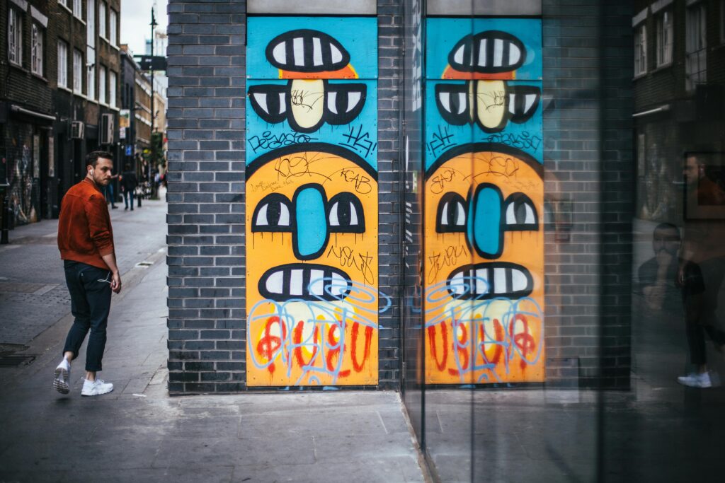 trendy Shoreditch neighborhood with street art, one of the best places to stay in London for young travelers"