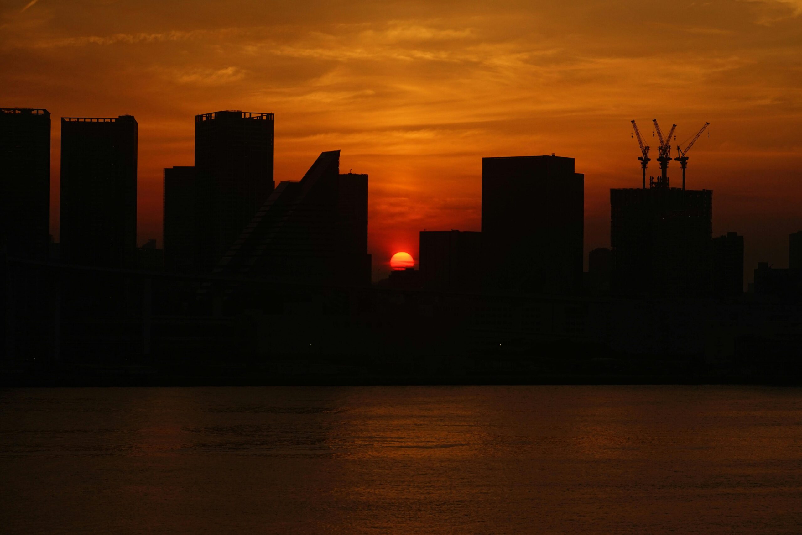 Sunset view of Tokyo skyline with mix of traditional temples and modern architecture