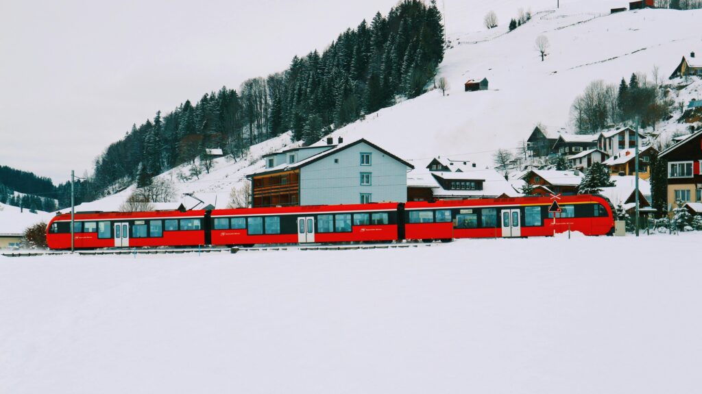 Swiss train journey through winter landscape during the best time to ski in Switzerland