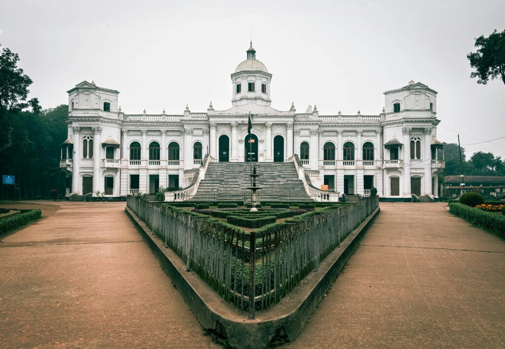 Exterior view of Tajhat Palace in Rangpur, Bangladesh, showcasing its elegant white façade, grand staircase, and neoclassical architecture