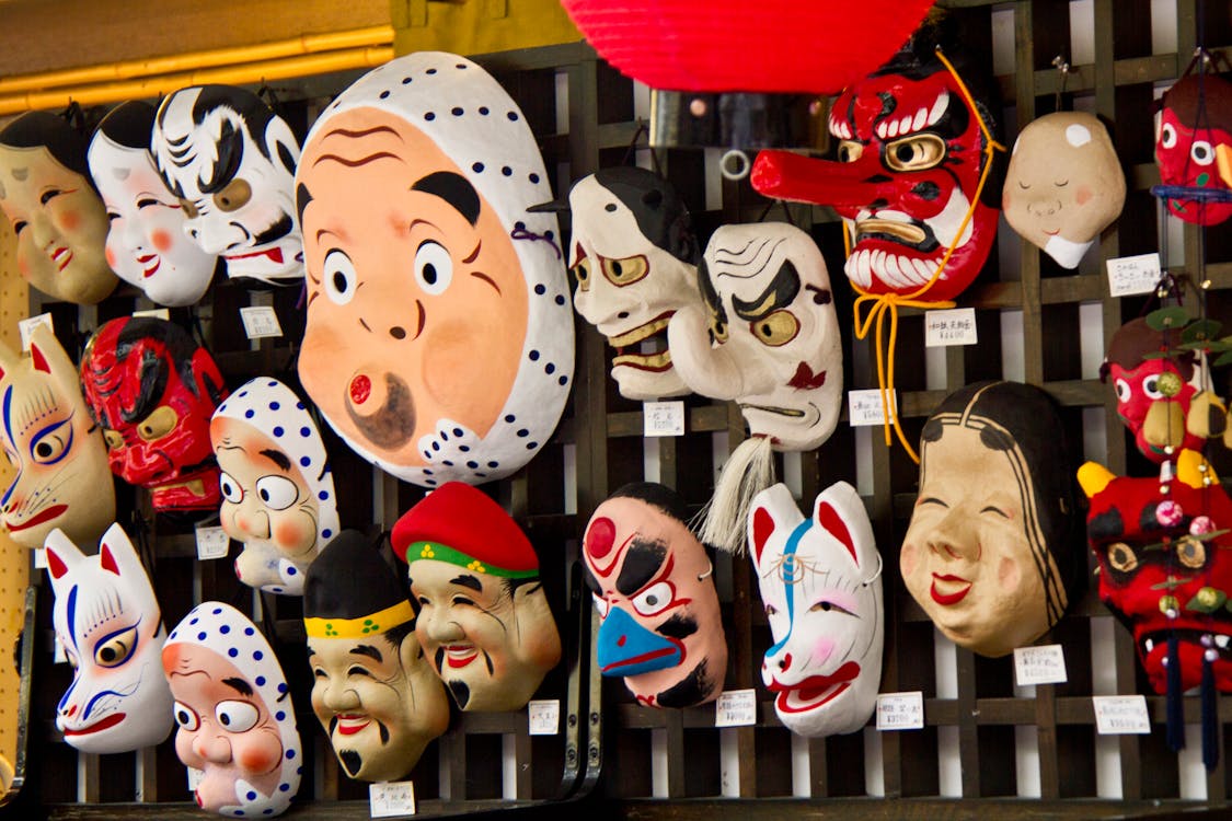 Traditional Japanese Tengu mask with long nose and fierce expression, symbolizing protection and mischief in Japanese folklore