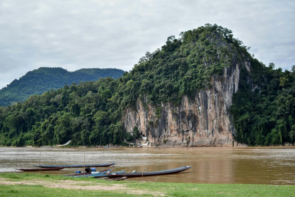 Traditional boat journey on the Mekong, connecting many of the best places to visit in Laos