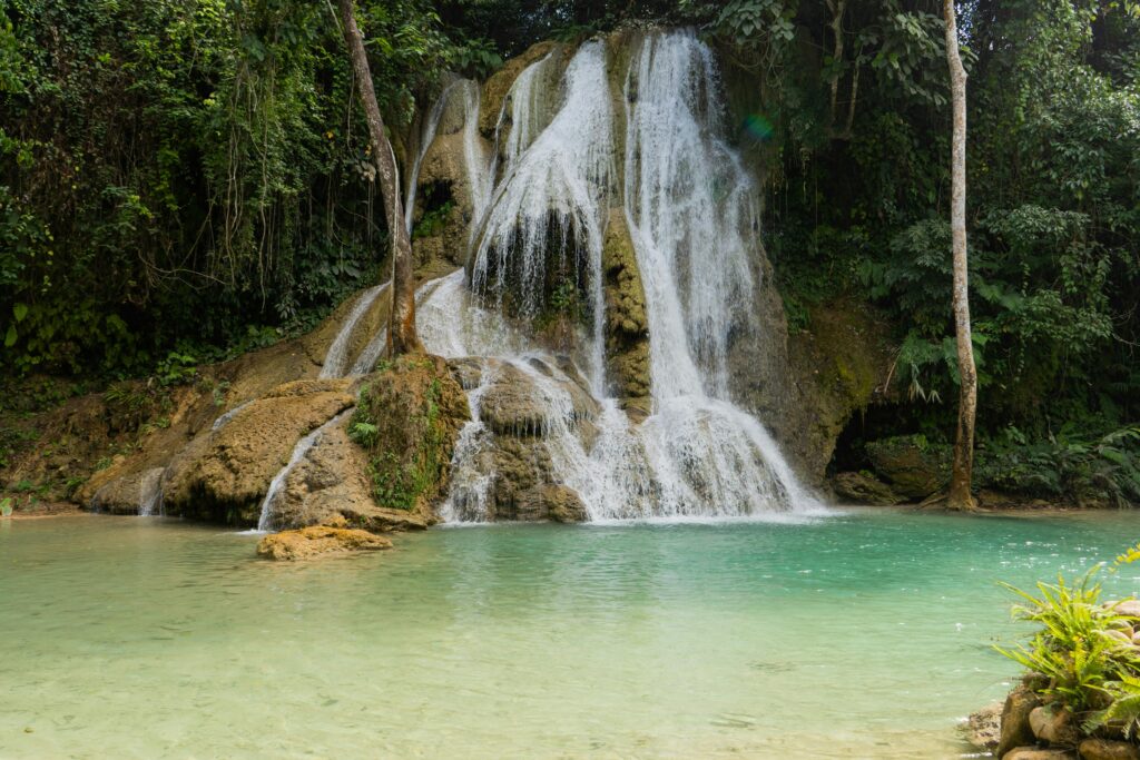 The stunning turquoise waters of Kuang Si Waterfall, among the best places to visit in Laos for natural beauty