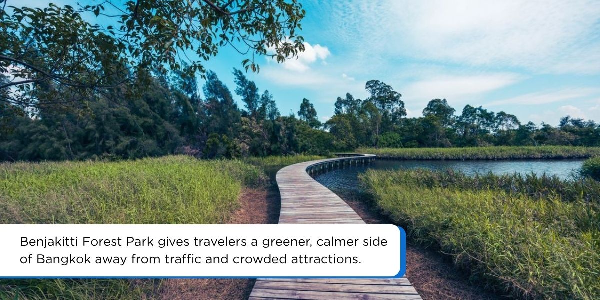 Benjakitti Forest Park in Bangkok with elevated walkways, greenery, and skyline views