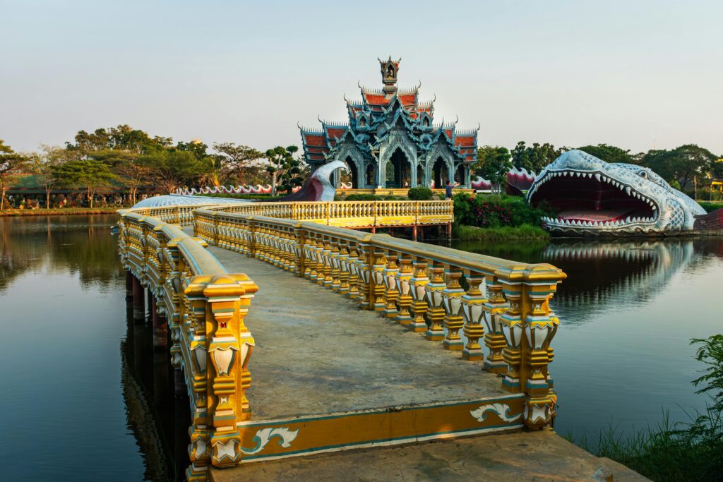 Pavilion of the Enlightened on island with giant Naga serpent sculpture at Muang Boran Ancient City, Thailand