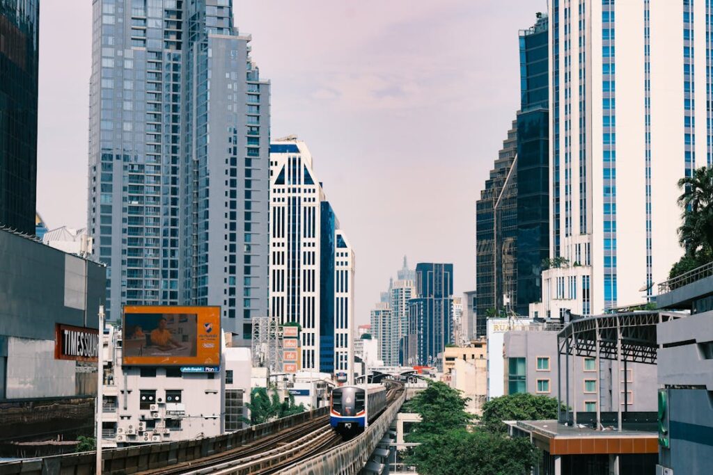 Bangkok travel tips - BTS Skytrain with city skyline showing efficient transportation