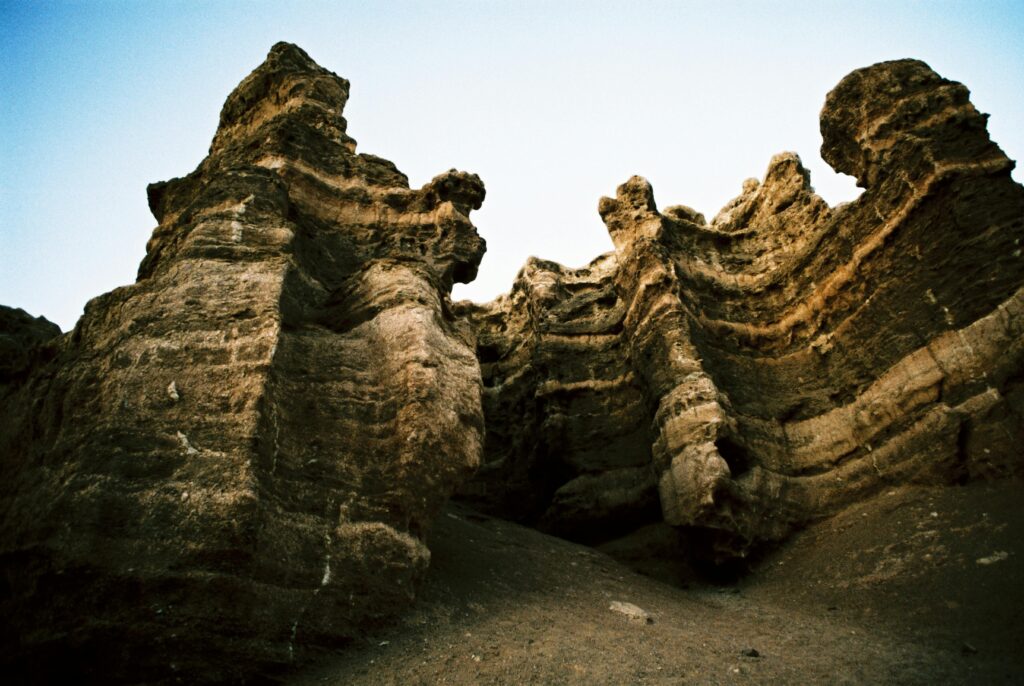Dramatic rock formations of Charyn Canyon in Almaty Region, Kazakhstan, captured under a clear blue sky
