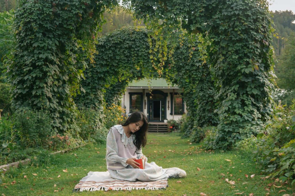 solo traveler enjoying a moment of reflection in a peaceful Japanese garden, showcasing personal growth aspects of solo travel to Japan