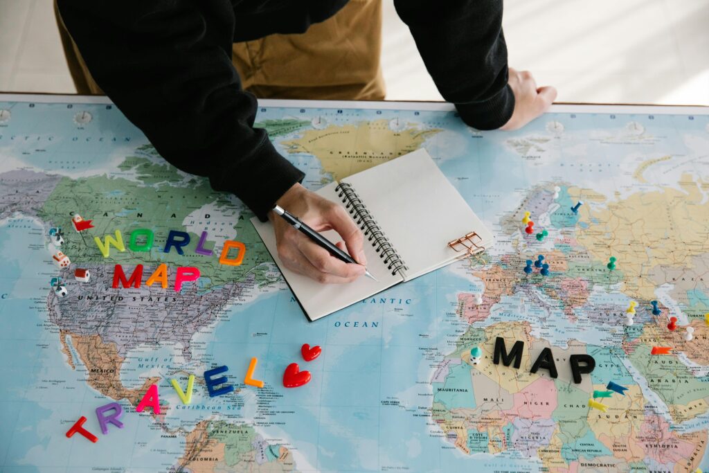 Solo traveler planning a Japan itinerary with maps and guidebooks, showcasing preparation for solo travel to Japan