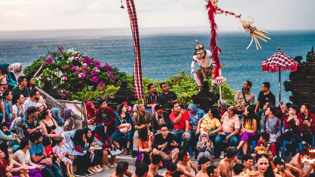 Crowd gathered at Uluwatu Temple in Bali to watch iconic Kecak cultural performances at sunset