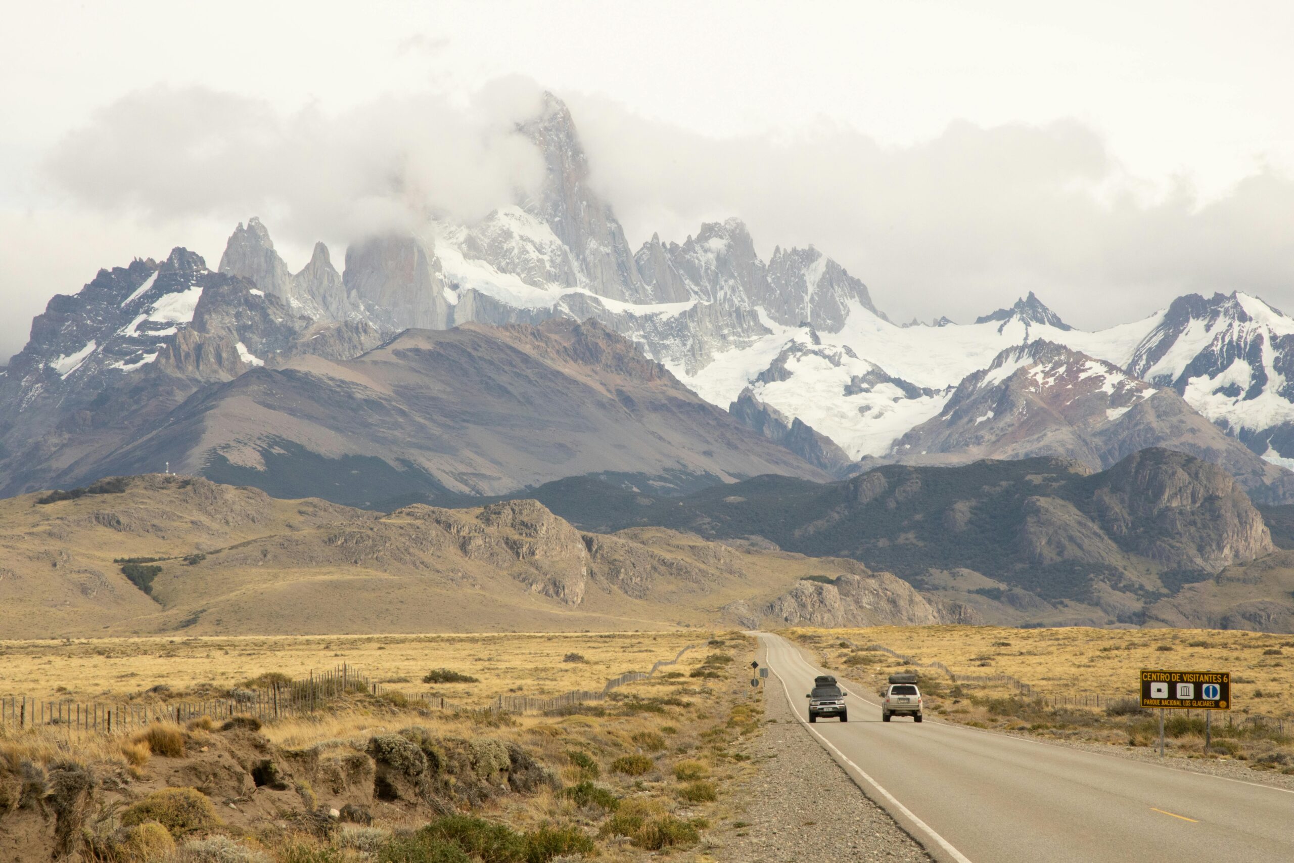  Scenic mountain road in Patagonia with a rental car driving along the route