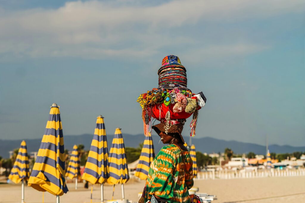African Vendor on Sardinian Beach - one of the best islands to visit in the world