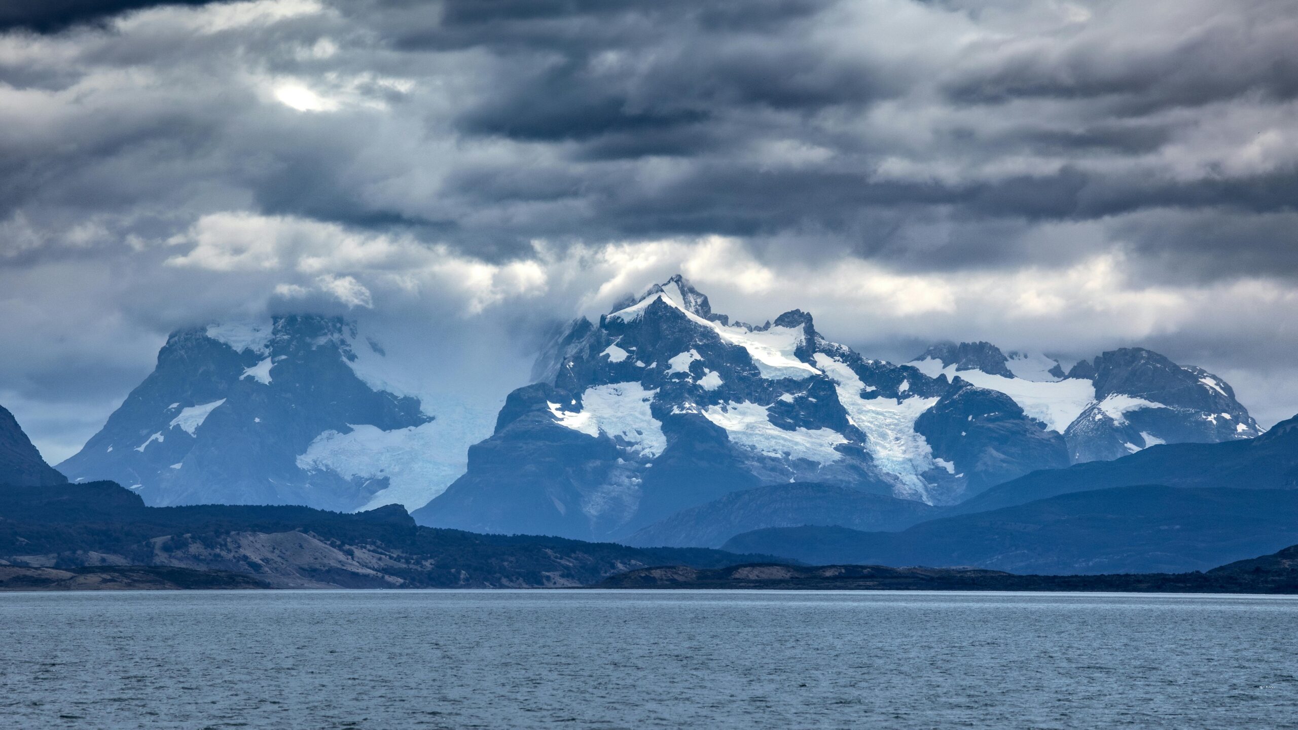 Dark storm clouds forming above Torres del Paine mountains in Patagonia Chile