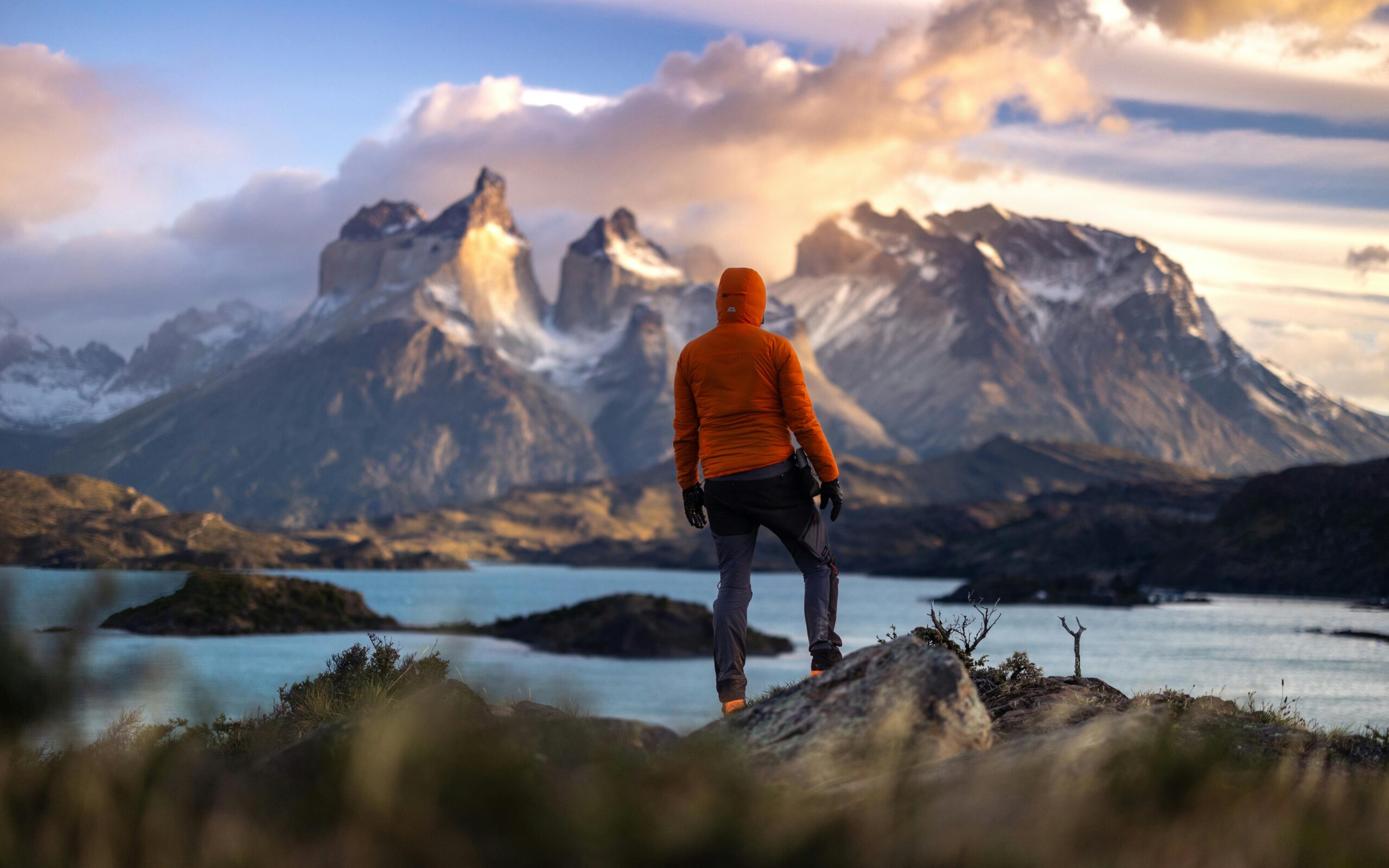Hiker looking at the moutains in Torres del Paine National Park Patagonia Chile