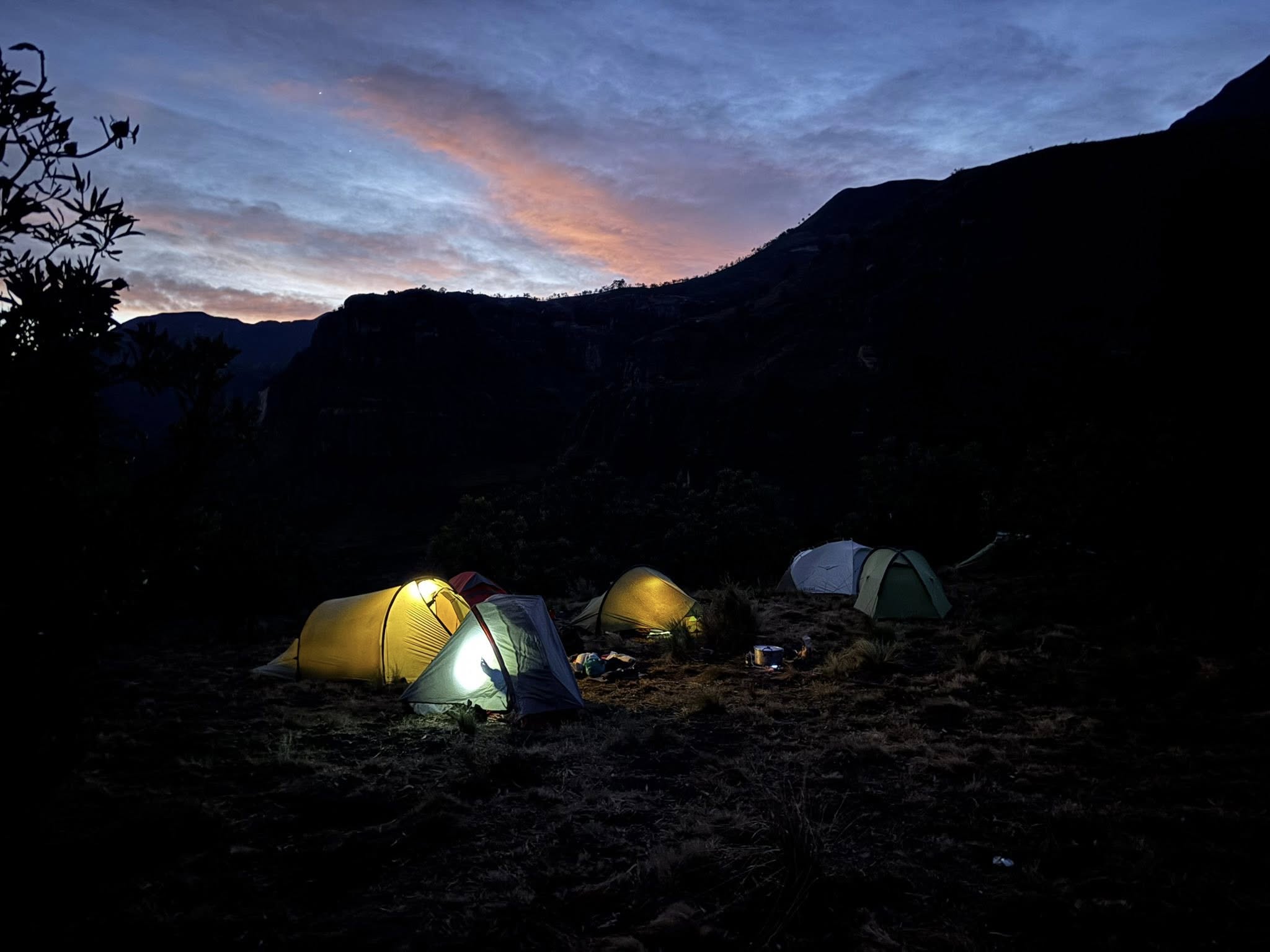 Tents glowing at dusk in Sehlabathebe National Park, Lesotho.